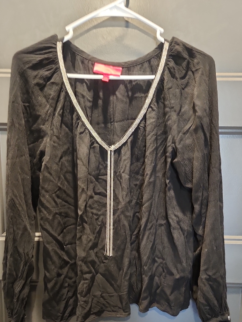 Jennifer Lopez Black Top with Bright Red Label